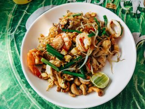 pad thai in white ceramic plate